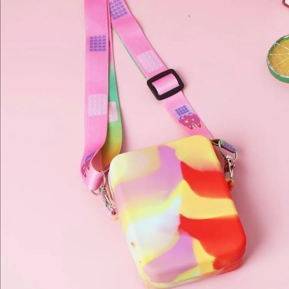 Pop-it crossbody. Tie dye color with adjustable cloth strap.